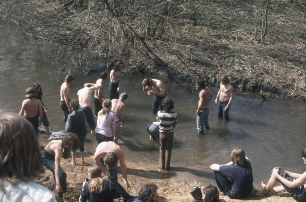 A group of young men and women bathe in Rowan Creek near York Farm during the Sound Storm music festival. (Courtesy of Wisconsin Historical Society)