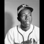 Head and shoulders portrait of Milwaukee Braves outfielder Henry "Hank" Aaron in his baseball uniform. 1954 was Aaron's rookie season.