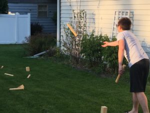 Chris Malina plays Swedish yard game kubb at his home in Fitchburg, Wisconsin.