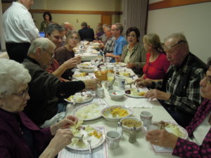 The Erlandson and Bunster families gather for the lutefisk dinner at Christ Lutheran Church in 2013.
