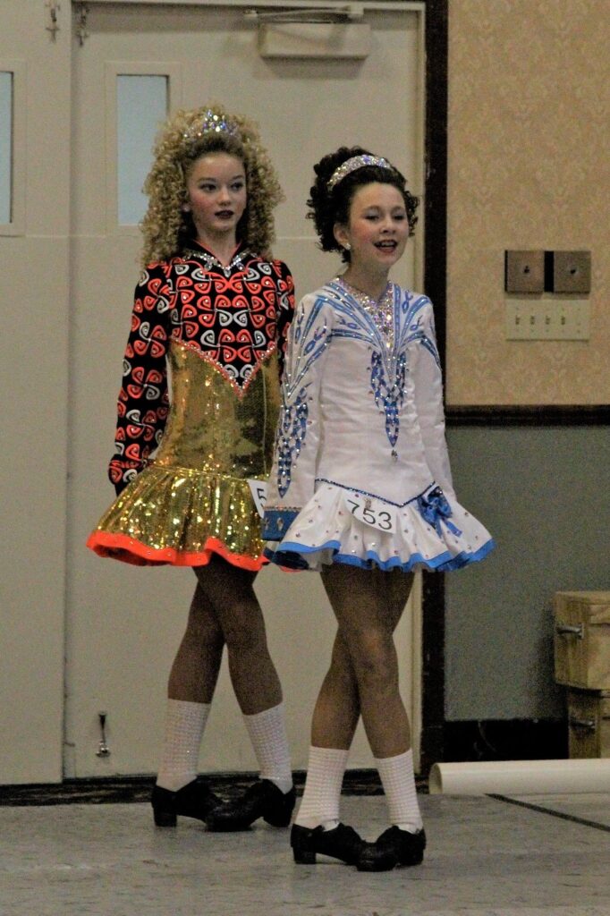 Megan Lilibridge (l-r) and Mary Papageorge prepare to compete in a treble jig competition. (Photo by Molly McCollum)