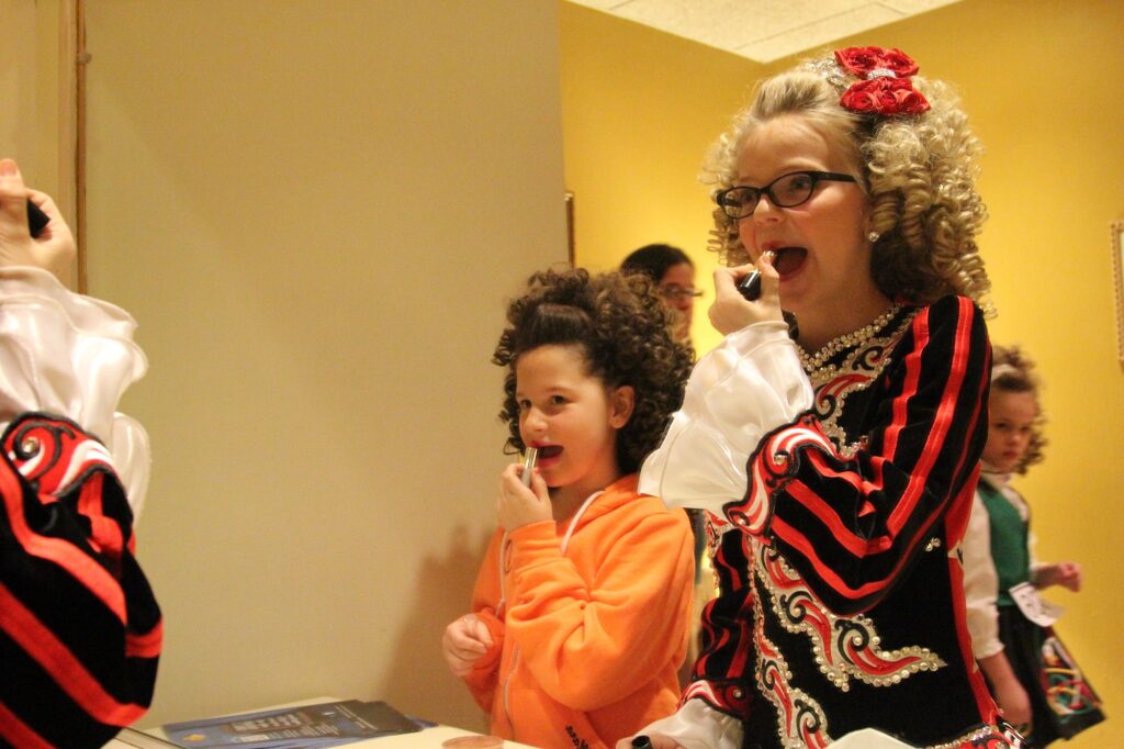 Irish dancers put on the final touches before competition. (Photo by Molly McCollum)