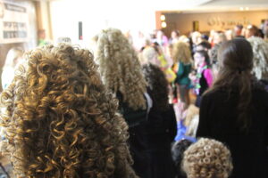 Many Irish dancers wear curly wigs during competitions. (Photo by Molly McCollum)