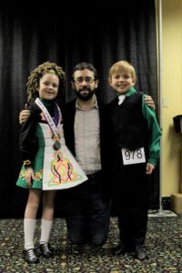 Sean Beglan of Beglan Academy of Irish Dance with two of his students. (Photo by Molly McCollum)