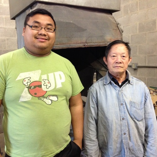 Apprentice Kong Mong Yang and master blacksmith Tong Khai Vang at the blacksmith shop at the Hmoob Cultural and Community Agency in La Crosse.