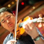 Wayne Lin plays the violin at the Weidner Center for the Performing Arts.