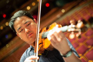 Wayne Lin plays the violin at the Weidner Center for the Performing Arts.