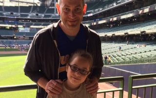 Brad Kolberg with his daughter at Miller Park.