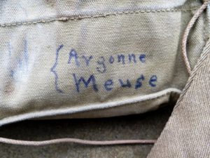 Vincent Hood's gas mask bag notes involvement in the Meusse-Argonne Offensive.