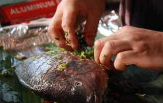 Stuffing herbs and spices into the whole fish