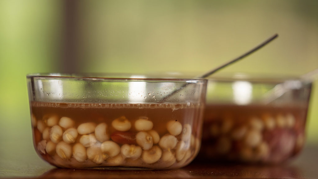 Two glass bowls of corn soup