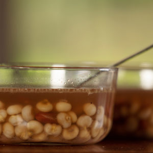 Two glass bowls of corn soup