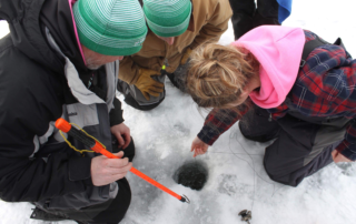 The day begins with setting the team’s tip-ups. No experience is needed to join many of Wisconsin’s ice fishing teams. Coaches can train new anglers how to compete. (Photo courtesy by Briley Hansen)