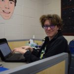MG21 student Sam McNurlan works at his desk at school. (Maureen McCollum/WPR)