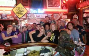 Briana Rupel and Sara Viner pose on the bar surrounded by Del's customers at the end of Oktoberfest weekend 2013. (Courtesy of Bri Rupel)