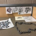 Some of the artwork and metalwork created by MG21 student Calvin Renard. (Maureen McCollum/WPR)