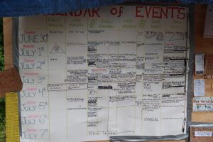 A calendar outlines daily events during the Rainbow Family gathering that ran from July 1-7. (Danielle Kaeding/WPR)