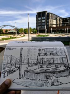 A scene out of Nishant Jain’s sketchbook depicts a newly-constructed plaza in downtown Eau Claire. (Courtesy of Nishant Jain)