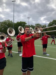 Junior civil engineering major Grant Petik is assistant drum major and plays in the trombone section. (Tim Peterson/WPR)