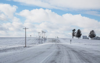 A fresh layer of snow covers County Road U/N in a rural farm area near Potosi, Wisconsin in winter. (Photo by Tony Webster)