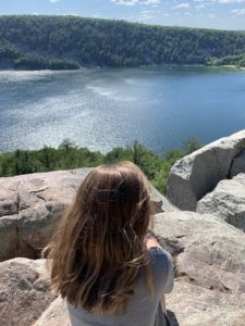 Kolberg's daughter looks out over Devils Lake from the East Bluff. (Brad Kolberg/WPR)