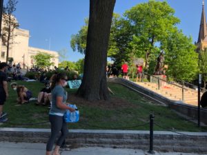 Demonstrators on the Capitol lawn in Madison, Wisconsin on June 2, 2020. Most people ate donated pizza while many wore 'Black Lives Matter' shirts. (Maureen McCollum/WPR)