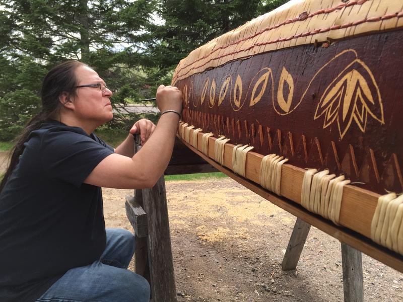 Wayne Valliere of the Lac du Flambeau Band of Lake Superior Chippewa etching a birchbark canoe in 2015. (Courtesy of Wayne Valliere/Native Arts & Cultures Foundation)