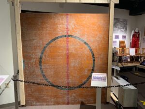 Among the items on display at the Sheboygan County Historical Society and Museum is the hardwood from the center circle of the basketball court. NBA players once played there. (Megan Hart/WPR)