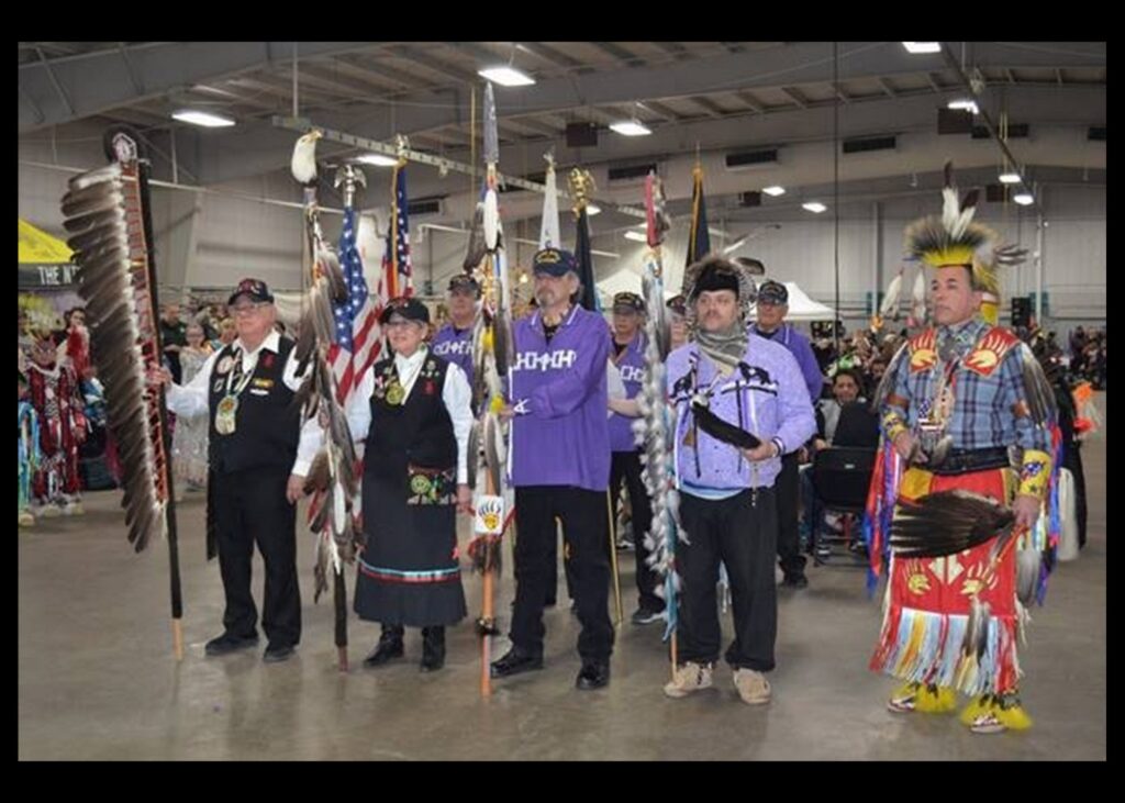 Indian Summer Festival Winter Powwow in West Allis, Wisconsin on March 11, 2018. (l-r) Mohican Veterans Commander Robert Little, US Marine Combat Veteran carrying the Mohican Veterans Eagle Staff and Major Jo Ann Schedler, US Army (Retired) carrying the Mohican Veterans Commemorative Eagle staff. (Photo by Jack Fennimore)
