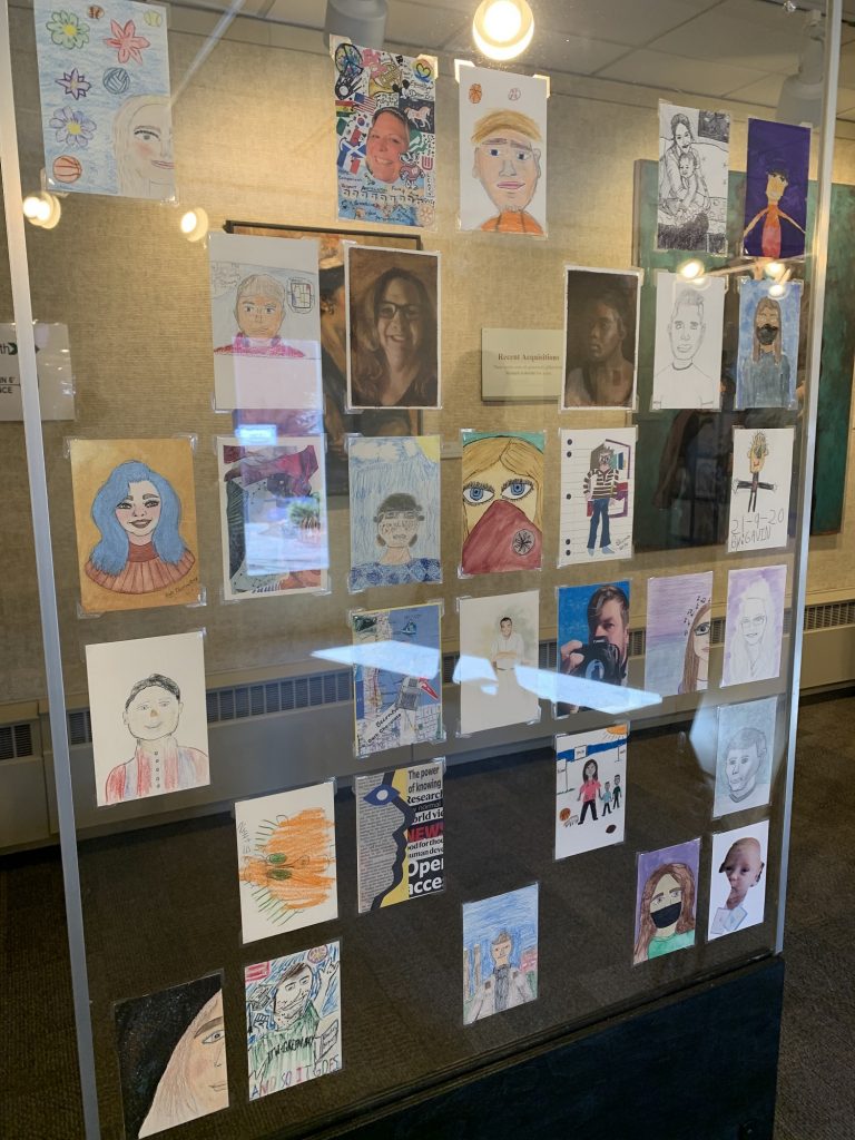 Some of the self-portraits made by community members as part of the "Portrait of Manitowoc" project. (Megan Hart/WPR)