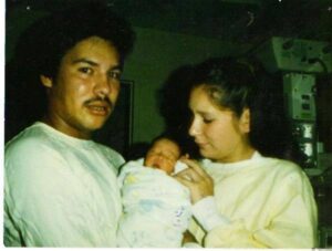 Rae Elaine Tourtillott (r) with her infant daughter, Alysse, and boyfriend, Bob. (Courtesy of Andrea Lemke-Rochon)