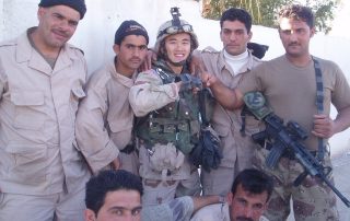 Yauo Yang (center) with a group of Iraqi soldiers that the U.S. Army Reserve would train to do security missions. (Courtesy of Yauo Yang)