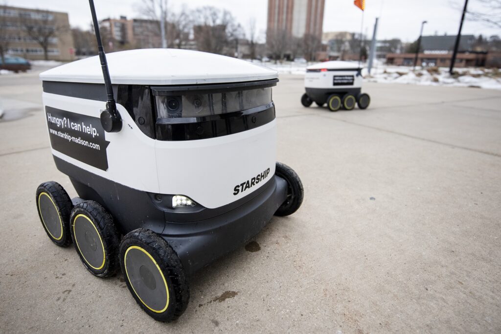 A Starship Technologies delivery robot returns after delivering food to customers Dec. 21, 2020, at UW-Madison. (Angela Major/WPR)