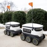 Starship Technologies delivery robots devices are parked in a line Dec. 21, 2020, at UW-Madison. (Angela Major/WPR)