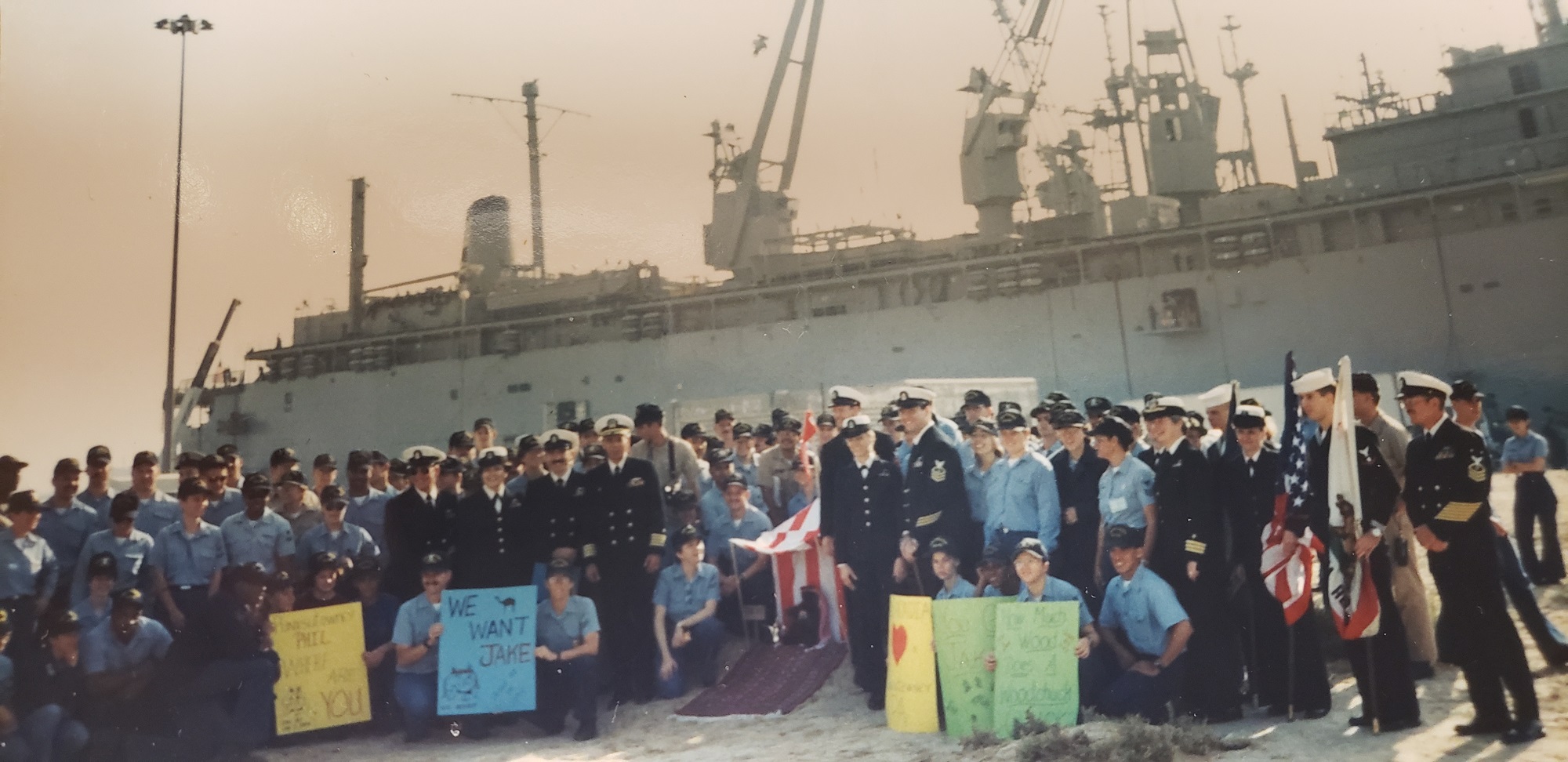 Legal Chief Lorrie McNeal Saylor and her fellow Navy officers next to a ship for a Punxsutawney Phil ceremony in Jebel Ali, United Arab Emirates. (Courtesy of Lorrie McNeal Saylor)