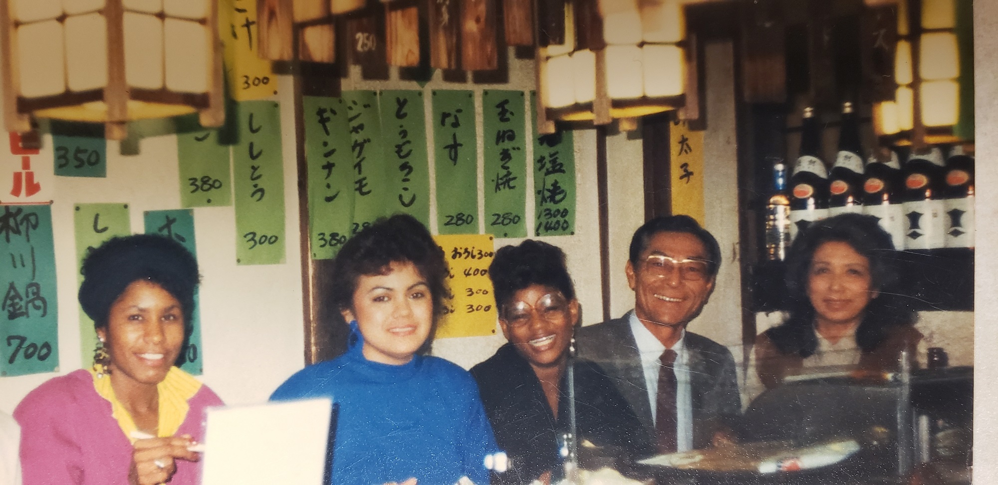 Lorre McNeal Saylor (middle) having dinner in Japan. (Courtesy of Lorrie McNeal Saylor)