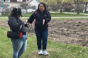 Human Powered producer Jade Iseri-Ramos (l) interviews gardener Sarah Ly at one of Brown County's community gardens. (Courtesy of Wisconsin Humanities)