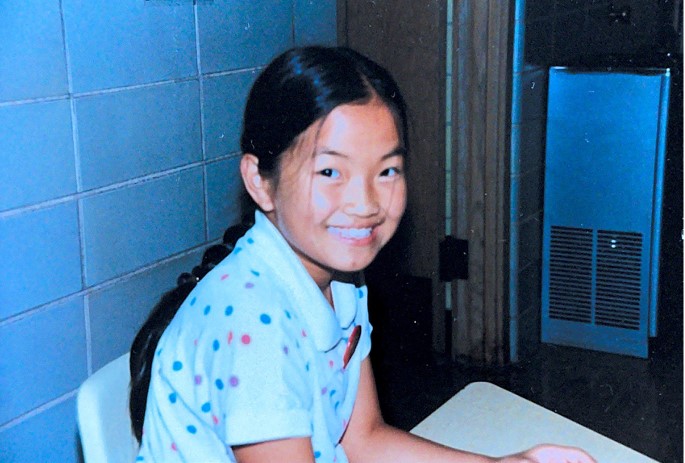Mixee Vang in her school hallway sometime around third grade. (Courtesy of Mixee Vang)