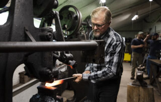 Boleslaw Kochanowski uses a power hammer to craft metal Tuesday, June 29, 2021, in Junction City, Wis.