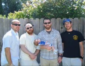 Dan Johnson, his older brother Peter, brother Will with his first born and his younger brother Erik on June 6, 2010. It's the last picture their mother, Holly Higgins, has of all four sons together. (Courtesy of Holly Higgins)