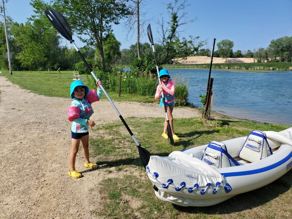 Mixee Vang's daughters getting ready to kayak to Mud Lake.