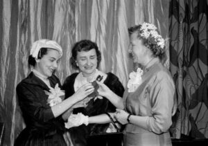 Advice columnist Ann Landers is shown with two writers who received awards at the Ladies of the Press breakfast.
