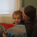 Jenny Peek reads to her two-year-old son Liam.