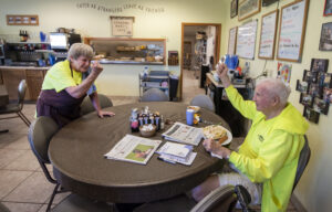 John Wick, right, and Rosie Peterson, left, share a greeting at Grandma Mary's Café on Wednesday, June 22, 2022, in Mazomanie, Wis. (Angela Major/WPR)