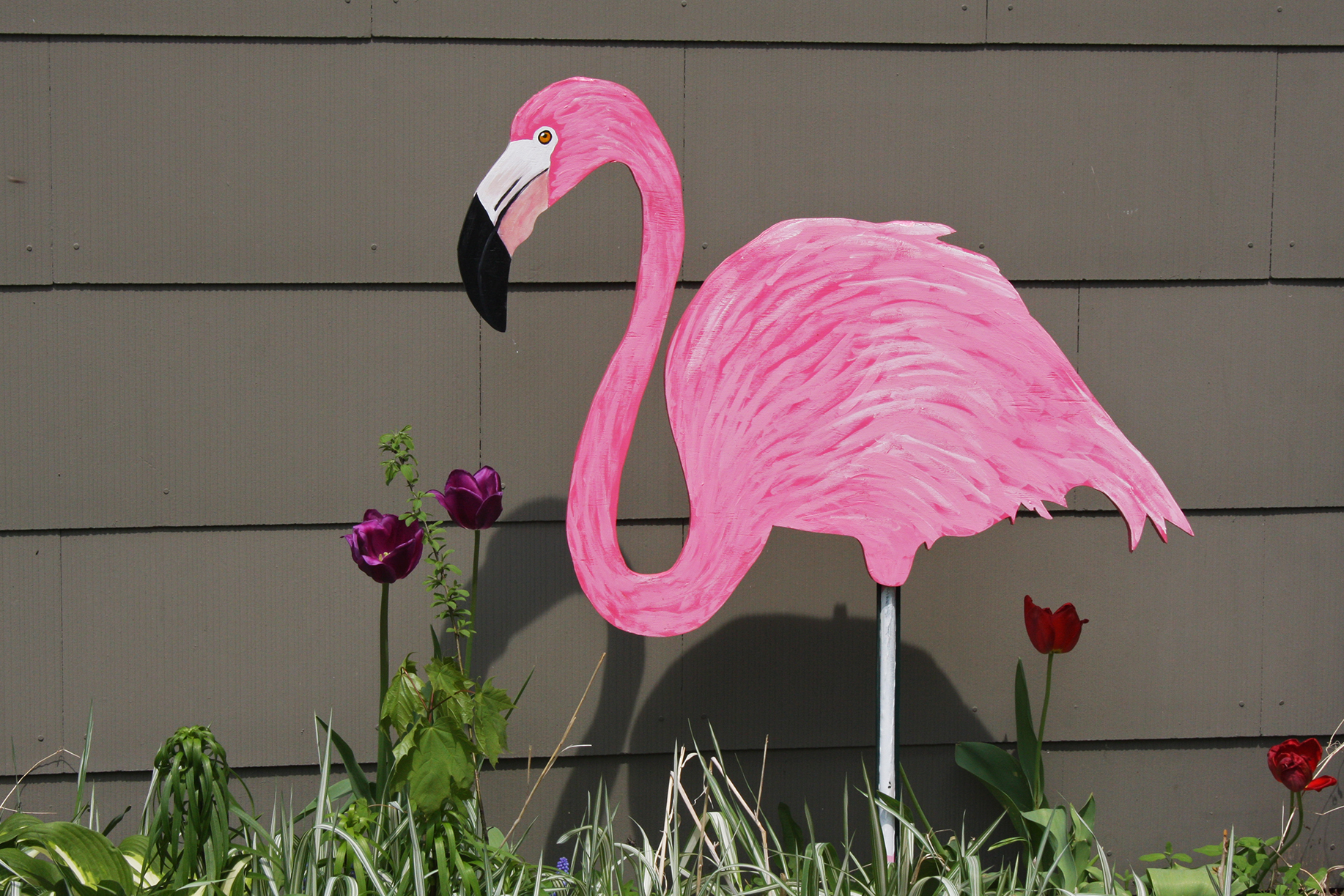 A wooden pink flamingo.