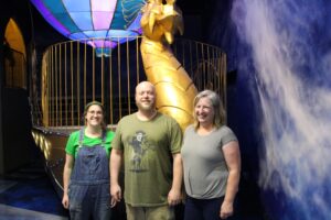 The Ricks family are the wizards behind the story, construction and gameplay of Wizard Quest. (l-r) Sculptor and set designer Cassie Ricks, artistic welder and set designer Braden Ricks and art director Corena Ricks. (Trina La Susa/WPR)