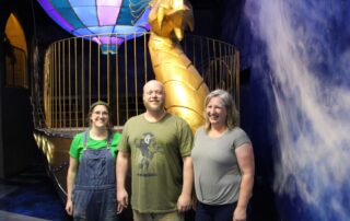 The Ricks family are the wizards behind the story, construction and gameplay of Wizard Quest. (l-r) Sculptor and set designer Cassie Ricks, artistic welder and set designer Braden Ricks and art director Corena Ricks. (Trina La Susa/WPR)