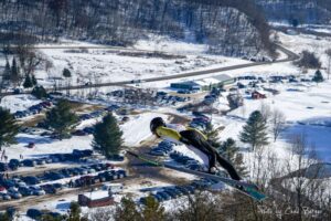 A ski jumper competes in the Snowflake Ski Club's tournament in Westby, Wisconsin in 2020. (Photo by Chad Berger)