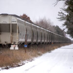 Train cars sit idly on tracks Wednesday, Nov. 16, 2022, in Trego, Wis. Angela Major/WPR