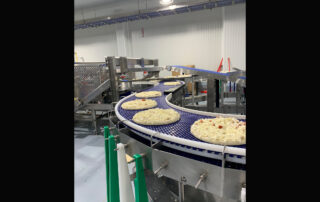 Frozen pizzas made in Wisconsin are on their way to being wrapped, packaged and then shipped to groceries stores across the Midwest. (Photos by Jana Rose Schleis)